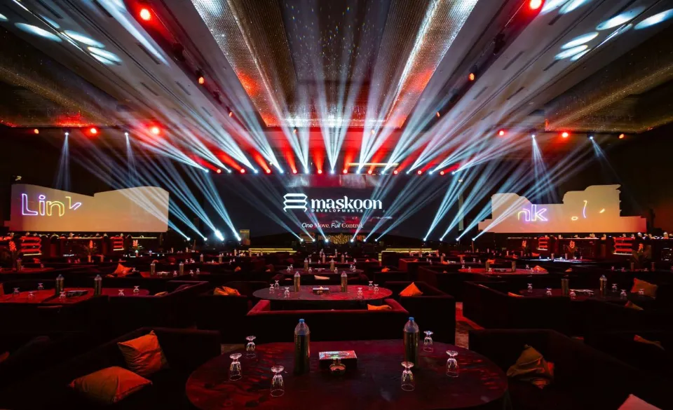 Maskoon Developments event stage with light beams
