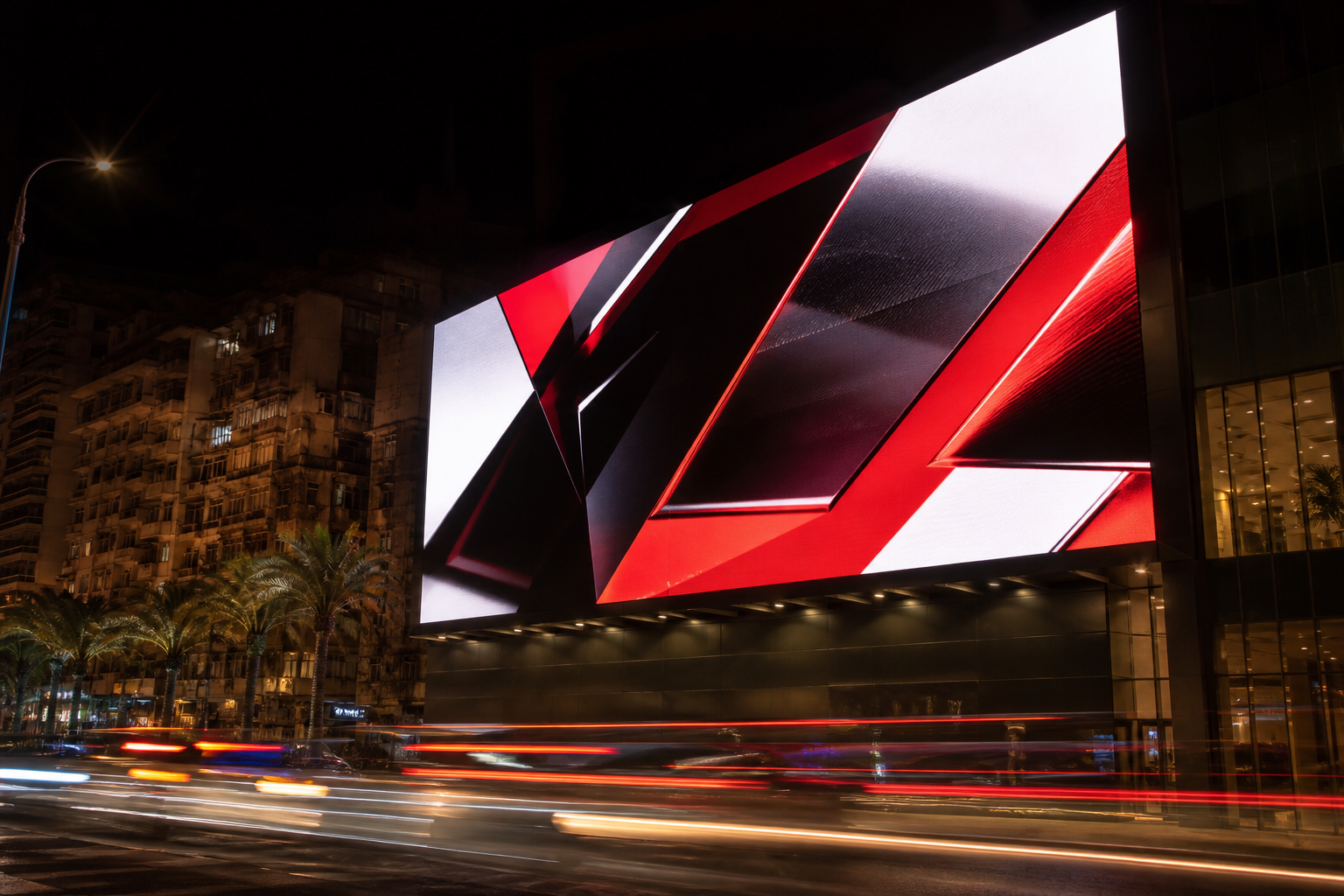 Large digital LED billboard above a Cairo street at night