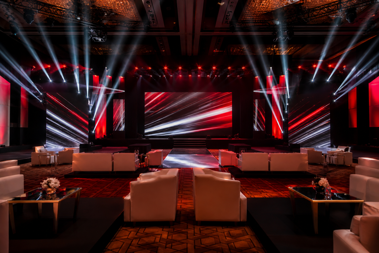 Premium corporate event stage with LED screens and dramatic lighting